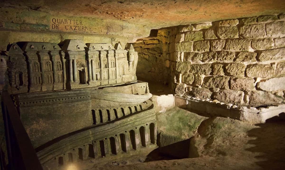Catacombs of Paris: Semi-Private Guided Tour in English The sculptures of Decure int he locked parts of the Catacombs