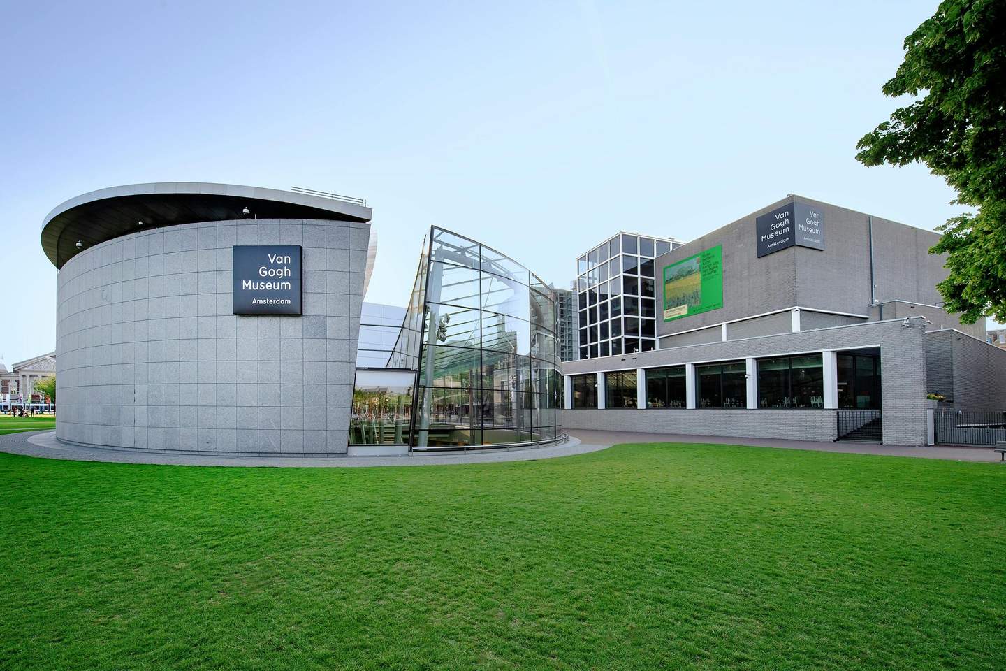 Van Gogh Museum Exterior view of the Van Gogh Museum in Amsterdam, featuring modern architecture with circular and glass structures and green lawn.